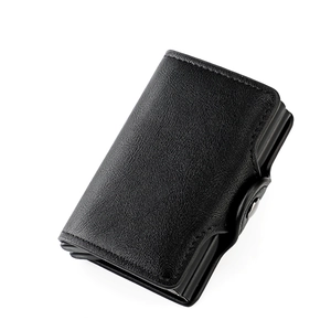 Detail of black RFID leather card holder with dual aluminum pop-up card mechanism and snap
