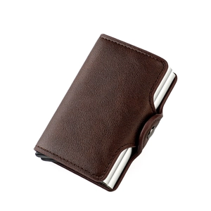 Detail of brown leather card holder with RFID aluminum case and snap closure