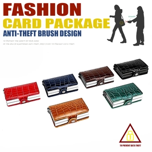 Macro detail of RFID-blocking metal card wallets with various alligator leather textures