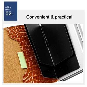 Detail of brown crocodile leather RFID card holder with silver metal frame and card ejector