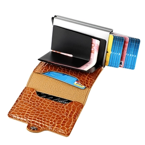 Detail of RFID aluminum card holder with brown crocodile texture leather and bill clip
