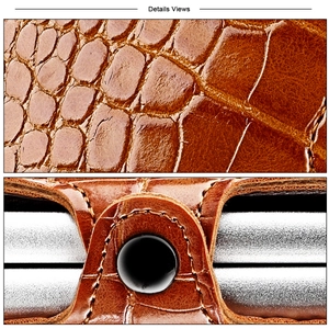 Detail view of brown crocodile texture leather wallet showing fine stitching and snap closure