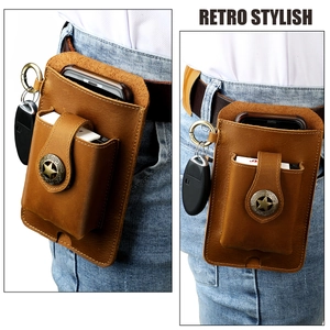 Detail view of brown crazy horse leather belt pouch with star buckle and key ring loop