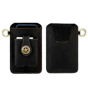 Detail of vintage black leather phone pouch with yellow stitching and star buckle