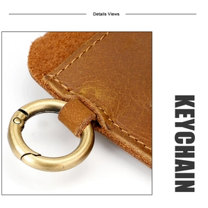Macro detail of brown crazy horse leather keychain with antique brass metal ring