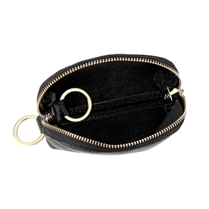 Detail view of black lychee leather key pouch with golden zipper and internal metal ring