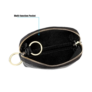 Macro view of black pebbled leather car key bag with multi-function internal pocket