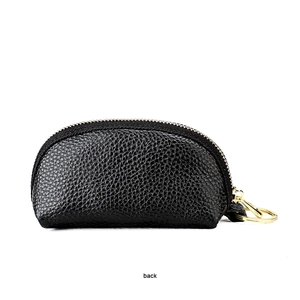 Back view of black litchi grain leather pouch with gold zipper and keychain ring