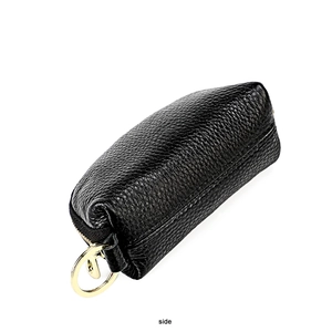 Detailed side view of black litchi grain leather key pouch with golden metal ring zip