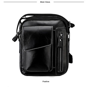 Front view of black leather crossbody bag with contrasting white stitching and strap