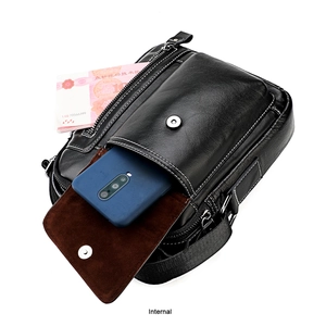 Detail of genuine leather shoulder bag showing magnetic front flap and inner storage for phones