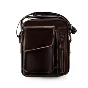 Detailed view of deep brown leather crossbody bag with multiple zip pockets and strap
