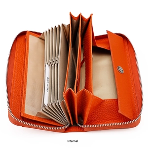 Internal view of orange leather wallet with accordion card slots and metal zipper