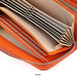 Internal view of orange leather wallet showing multiple accordion card slots and compartments