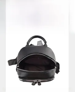 Interior view showing the main compartment and zipper pocket of a black leather backpack