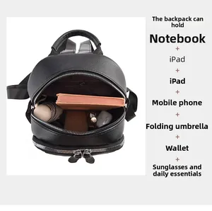 Internal storage view of black pebble leather backpack showing daily essentials capacity