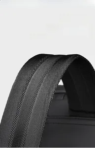 Detail of wide padded shoulder straps on black city backpack for heavy load comfort