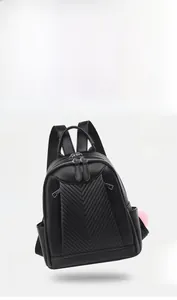 Detailed view of lightweight black pebbled leather backpack with V-pattern stitching, 0.34KG