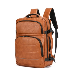 Brown leather business travel backpack with 17-inch laptop compartment and USB port