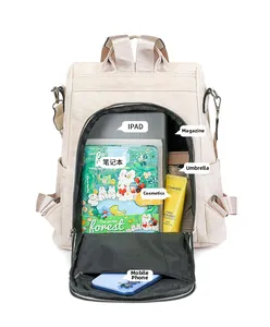 Intérieur spacieux du sac à dos beige montrant la capacité pour iPad, magazines A4 et accessoires