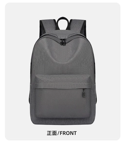 Front view showing high-density fabric texture and front pocket of the grey backpack