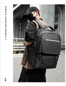 Detail of black waterproof nylon backpack with multi-layer zippers and side mesh pockets