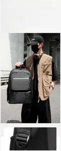 Detail of water-resistant black backpack with double buckles and side mesh pockets