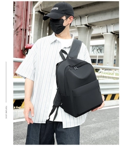 Street view of a black large capacity oxford backpack for travel and commuting