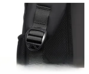 Detail of durable plastic adjustment buckles and reinforced stitching on black backpack