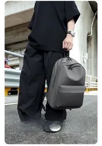 Detailed view of dark grey casual oxford cloth backpack with front zipper pocket and texture