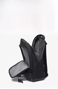 Detail of multi-functional black travel backpack showing side mesh pocket and striped lining
