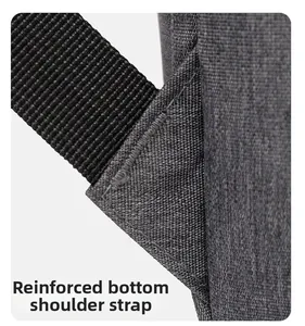 Detail view of reinforced bartack stitching on the grey oxford backpack shoulder strap