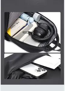 Spacious black waterproof backpack showing wide opening with striped lining and front pocket