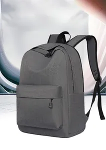 Detail view of large capacity gray oxford fabric backpack with padded S-shaped shoulder straps