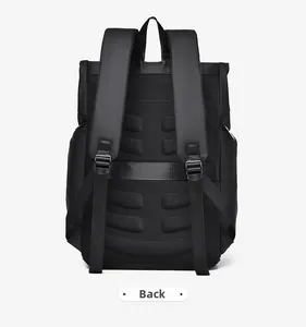Detail of the ergonomic padded back panel and suitcase strap on black backpack