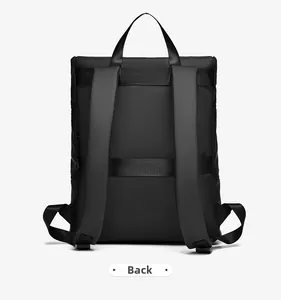 Detail view of the backpack back with padded shoulder straps and luggage trolley strap
