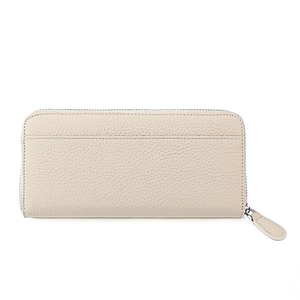 Macro view of creamy lychee grain leather texture and wrap-around zipper detail