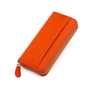 Orange long leather RFID wallet for women with pebbled texture and secure U-zipper closure