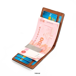 Detailed interior of slim leather wallet with metal money clip and vertical card slots
