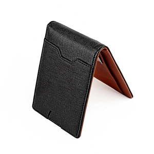 Detail view of bi-fold men's wallet showing black Saffiano texture and brown inner lining