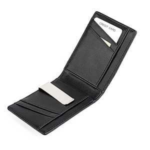 Detail of slim leather wallet interior with silver money clip and card slots