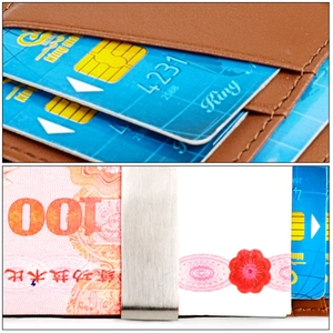 Macro detail of brown leather cardholder showing multiple card slots and metal money clip