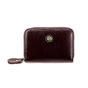Macro view of vintage wine red card holder with gold rose emblem and zip closure