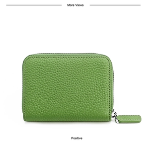 Detailed view of green lychee leather wallet with U-shaped zipper and leather puller