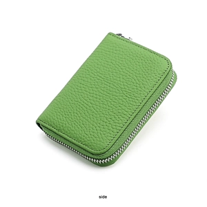 Detailed side view of the green pebble leather wallet with secure silver zipper closure