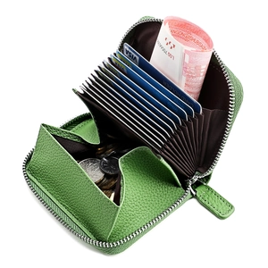 Interior detail of green leather RFID wallet with accordion slots and coin pocket