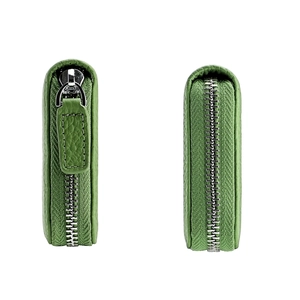 Detail of green litchi leather coin purse showing secure zipper closure and side view