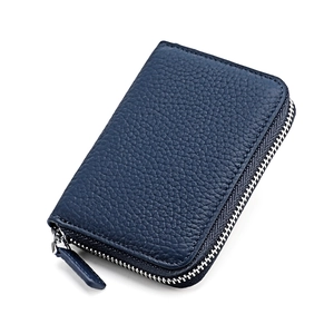 Close-up of dark blue pebble leather wallet with high-quality silver zipper and stitching