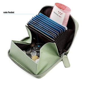 Top view of leather accordion card holder with interior coin pocket and smooth metal zipper