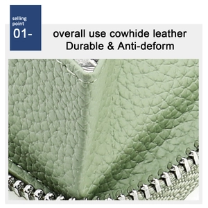 Close-up of light green cowhide leather wallet with durable litchi texture and zipper